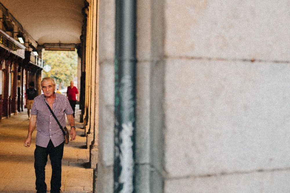 Middle-aged man walking confidently.