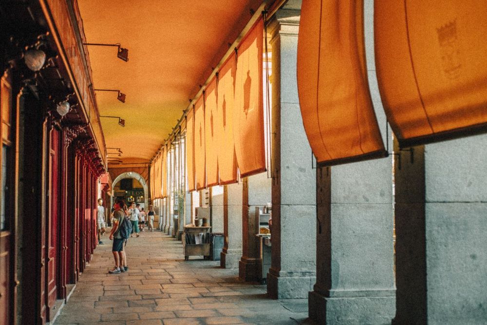 Golden corridor of arches glowing in late sunlight.